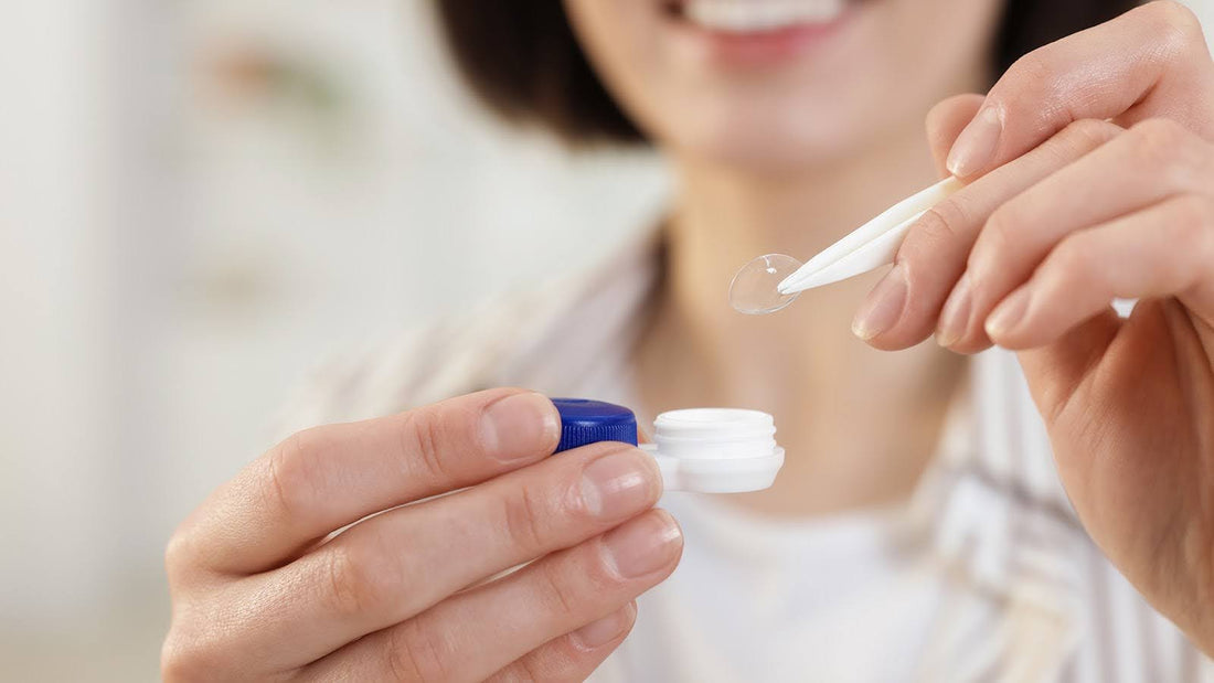 Woman putting the lens back into its container